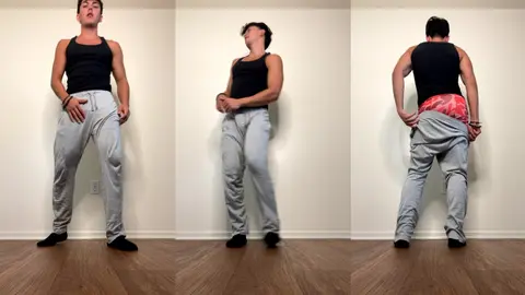 Je danse et baisse mon pantalon pour montrer mon slip rouge