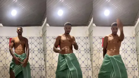 Josivaldo, torse nu et musclé, danse enroulé dans un paréo vert